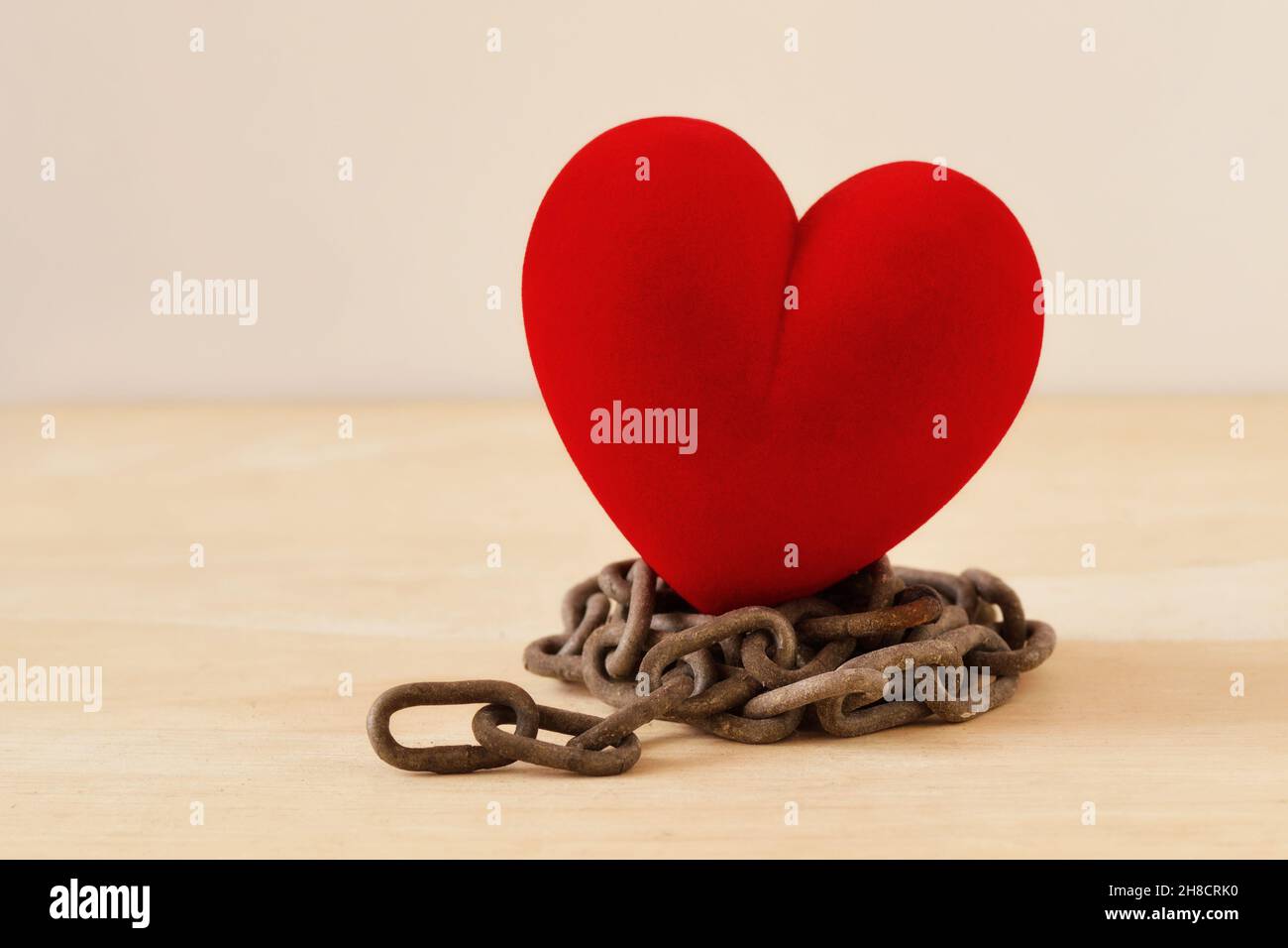 Heart on iron chain - Concept of love and freedom Stock Photo