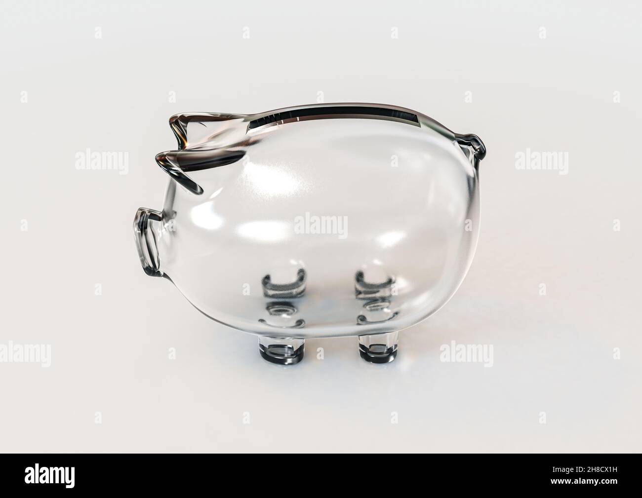 An empty transparent glass piggy bank on an isolated white background ...