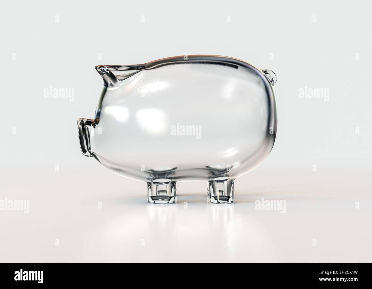 An empty transparent glass piggy bank on an isolated white background ...