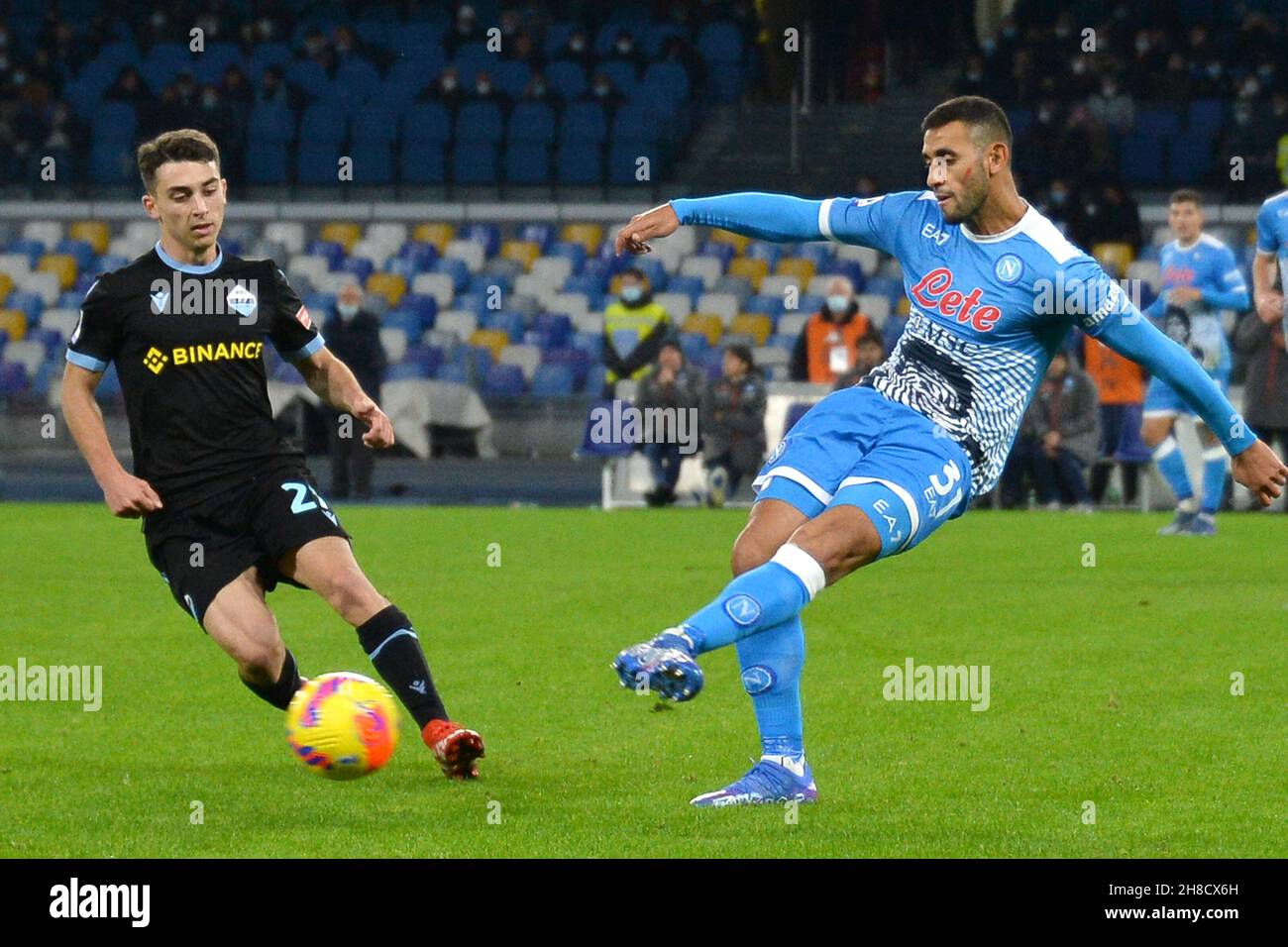 NAPELS, ITALY - NOVEMBER 28: Elseid Hysaj of SS Lazio battles for the ball with Faouzi Ghoulam of SSC Napoli during the Serie A TIM match between SSC Napoli and Lazio Roma at Stadio Diego Armando Maradona on November 28, 2021 in Napels, Italy (Photo by Ciro Santangelo/Orange Pictures) Stock Photo