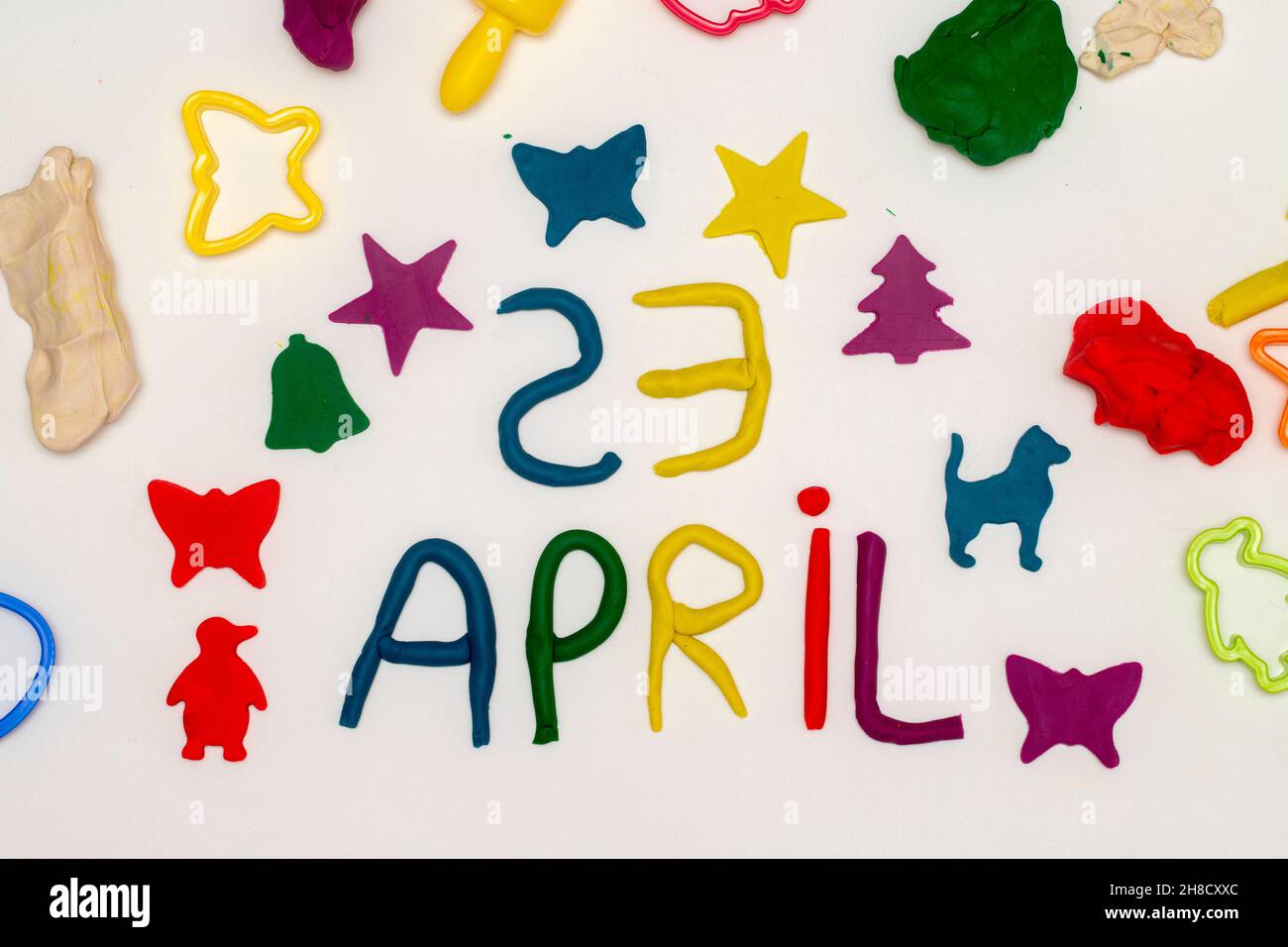 23 April inscription and figures written with dough on a white background. 23 april world children's day Stock Photo