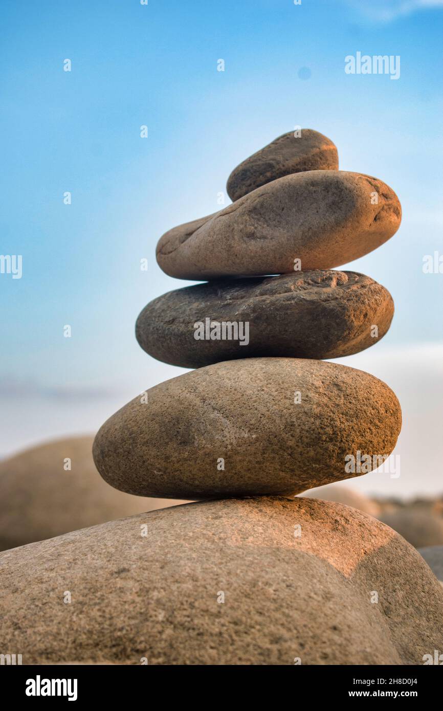 Balanced stones on a pebble beach during sunset in Bangladesh Stock ...