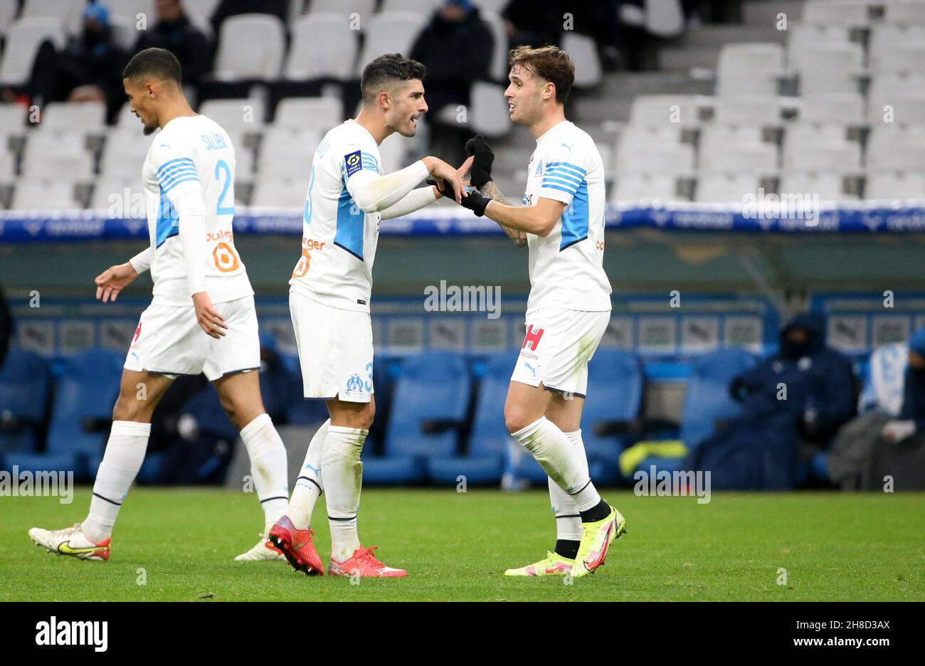 Pol Lirola of Marseille celebrates his goal with Alvaro Gonzalez (left) during the French championship Ligue 1 football match between Olympique de Marseille and ESTAC Troyes on November 28, 2021 at Orange Velodrome stadium in Marseille, France - Photo Jean Catuffe / DPPI Stock Photo