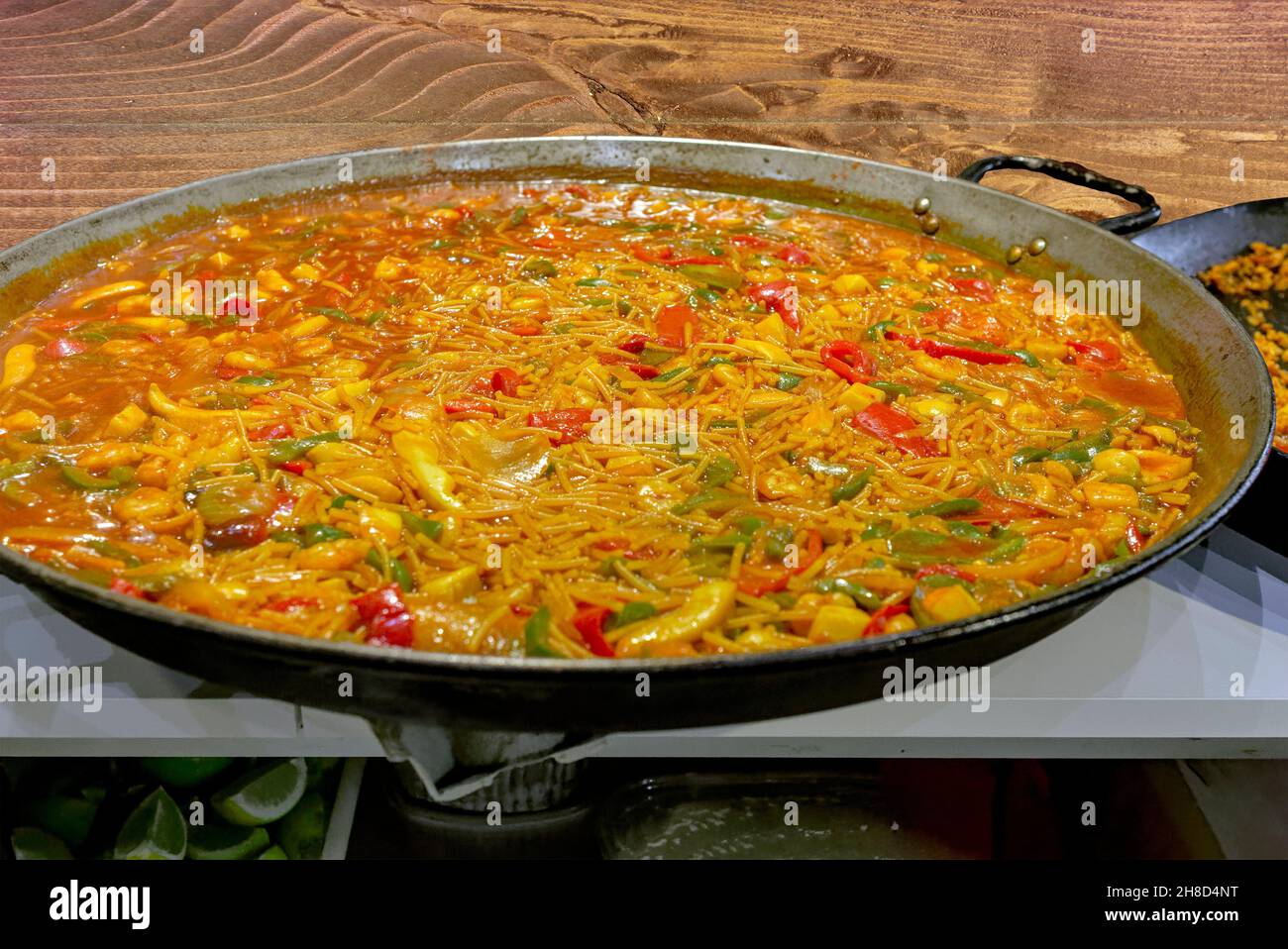 Traditional Spanish fideua. Noodle paella isolated on white background. Top  view Stock Photo - Alamy