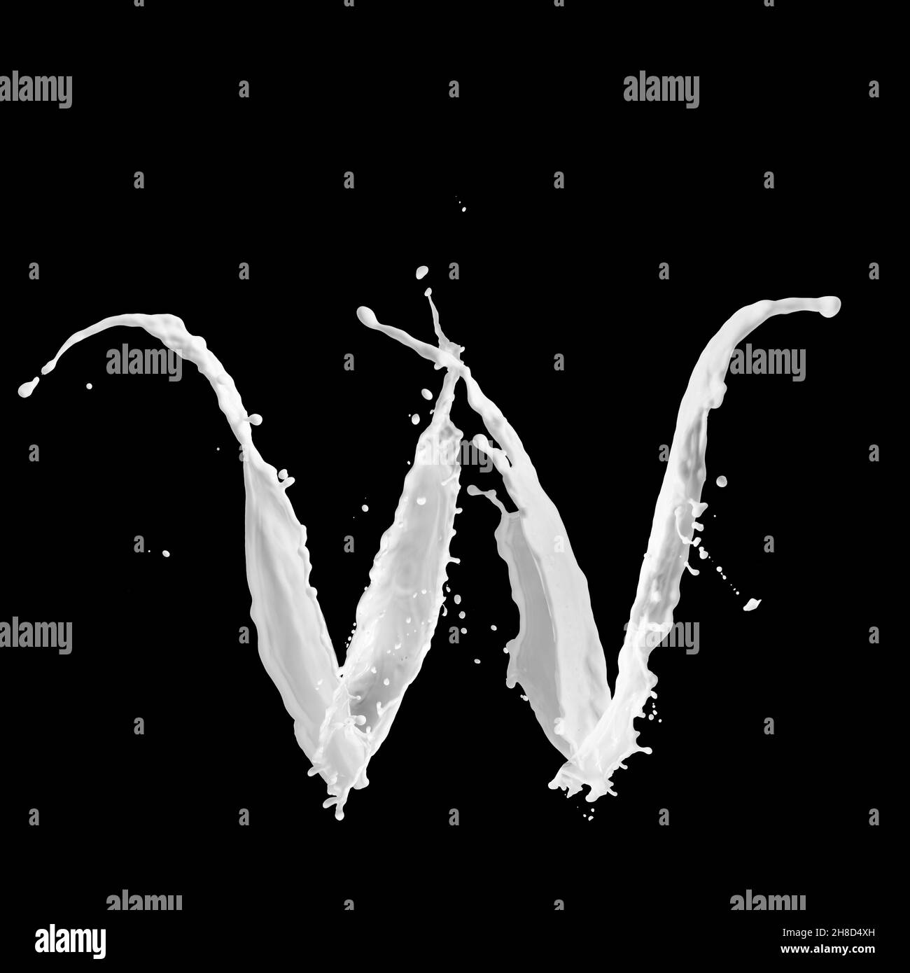 Letter W made of milk splash, isolated on black background Stock Photo