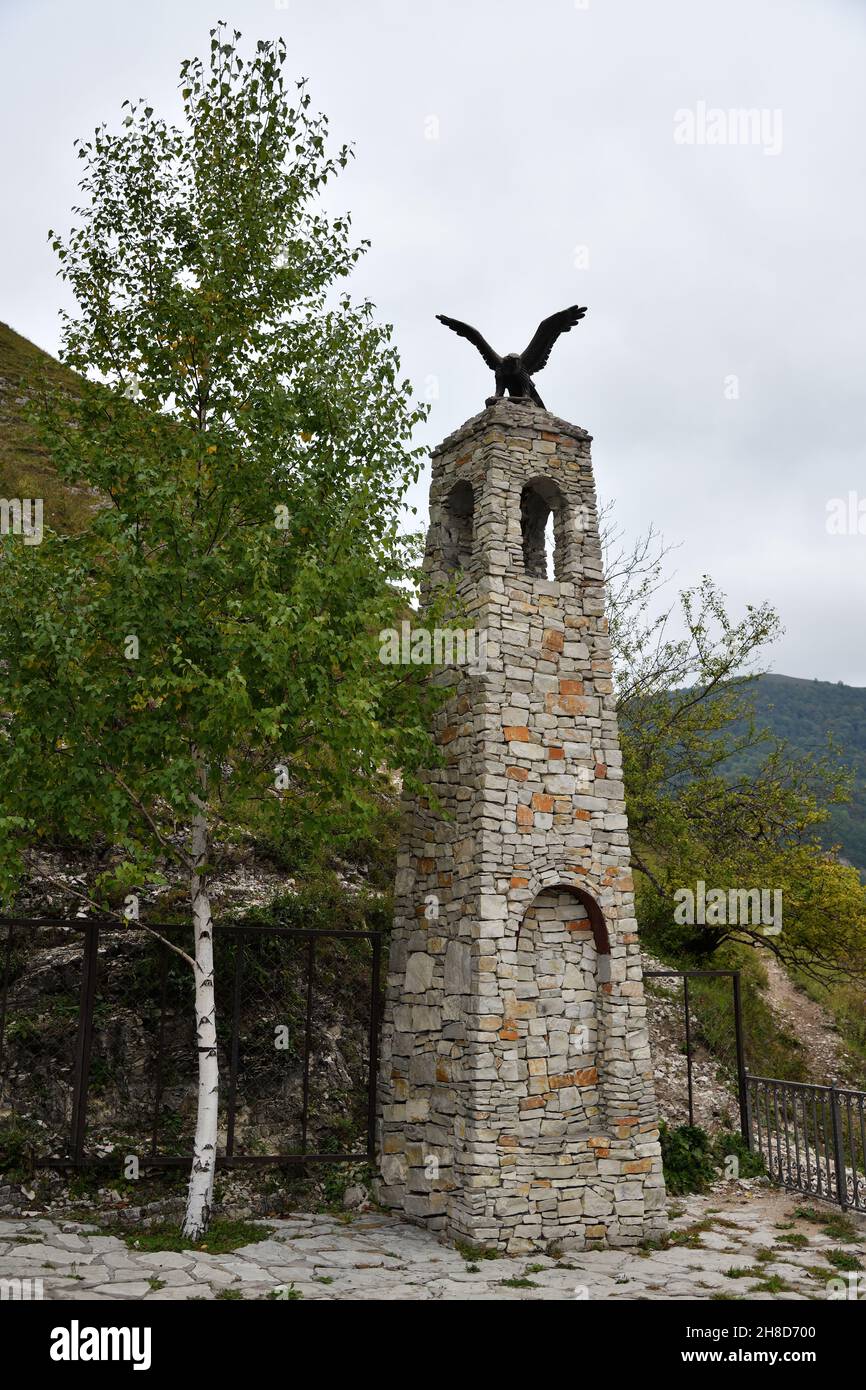 Chechnya, Russia -  September 10, 2021: Replica of battle tower with bronze eagle on top. Zelimkhan Harachoevskiy monument, famous Chechen abrek, warr Stock Photo