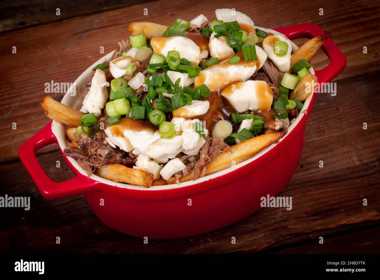 duck confit poutine dish on wood table poutine is a canadian meal made