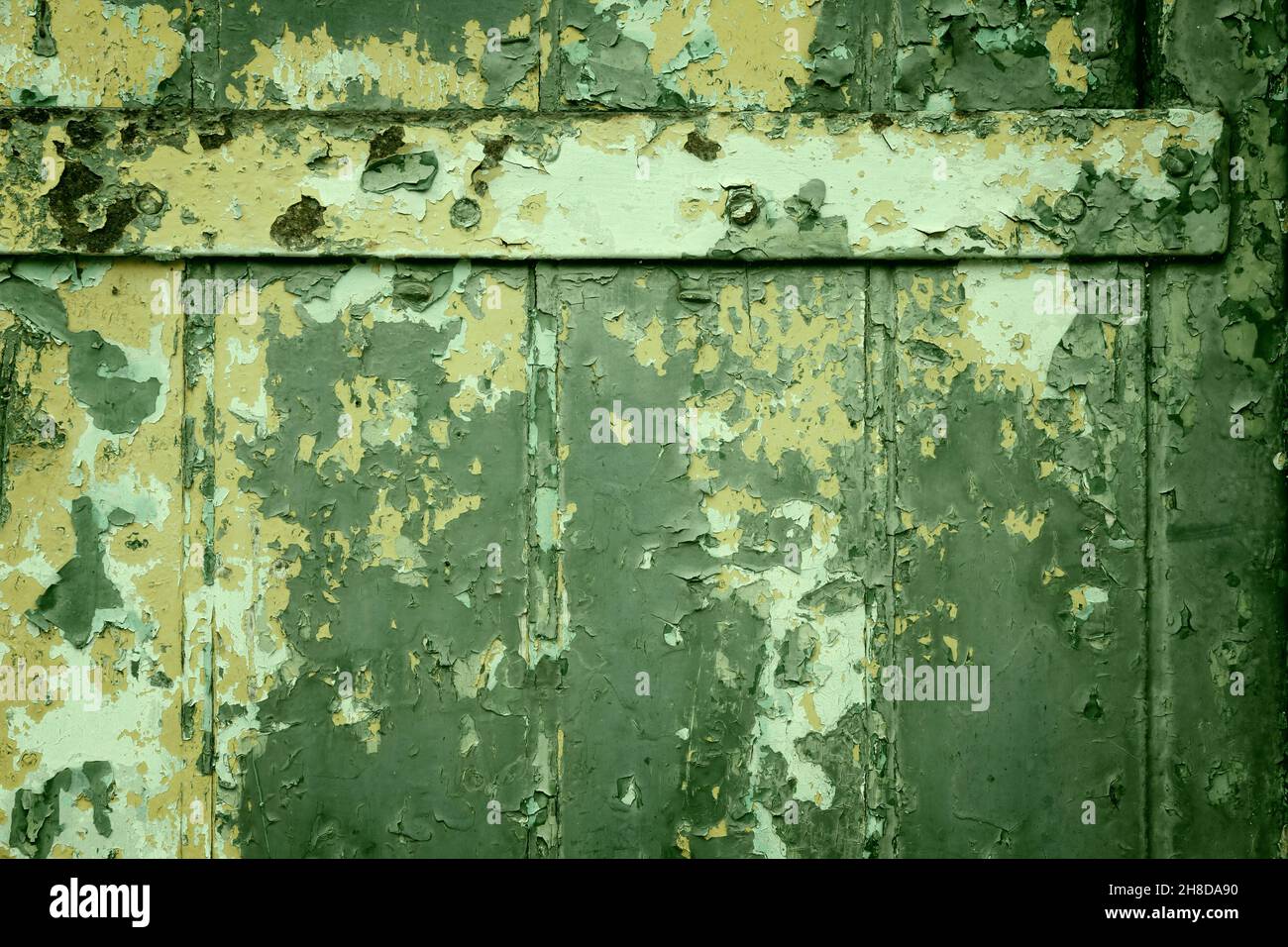 Peeling paint texture. Grunge style old wooden door background. Stock Photo
