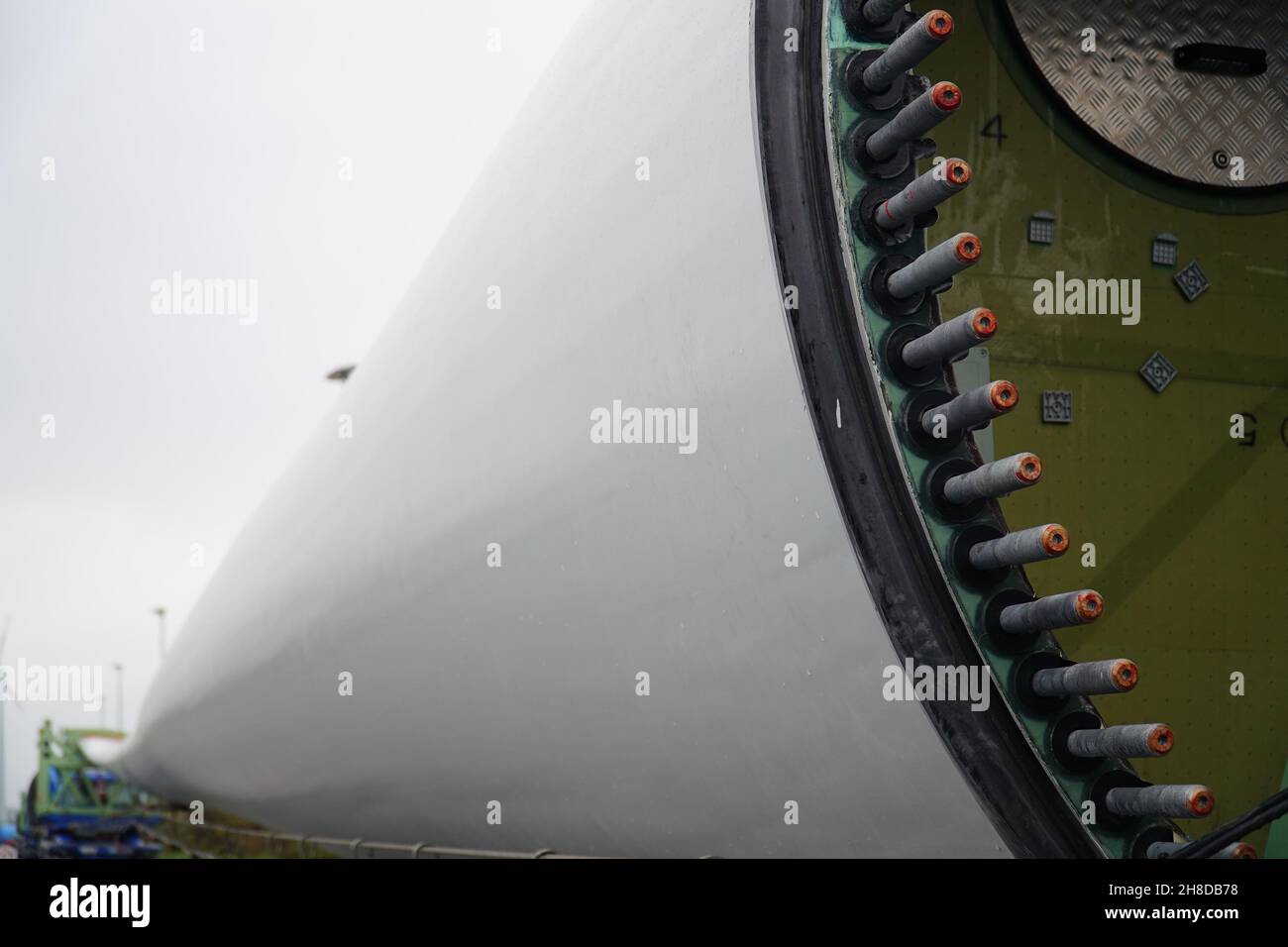 Fastening bolts of a blade from a new wind turbine on an extremely overlong heavy transport truck. German A2 freeway in Hannover district, Germany Stock Photo