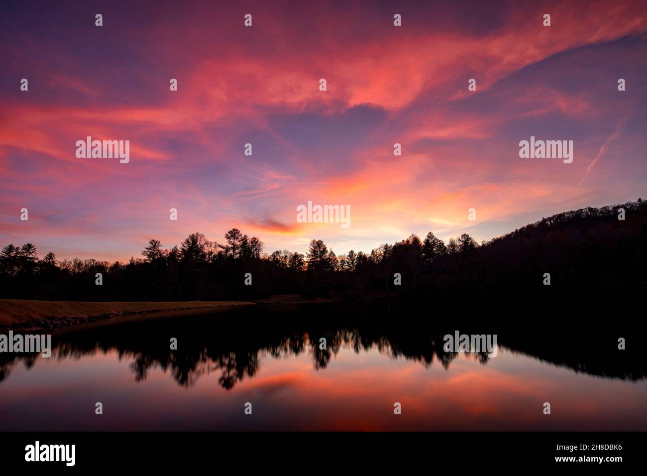 Straus Lake reflections at sunset - Brevard, North Carolina, USA Stock Photo