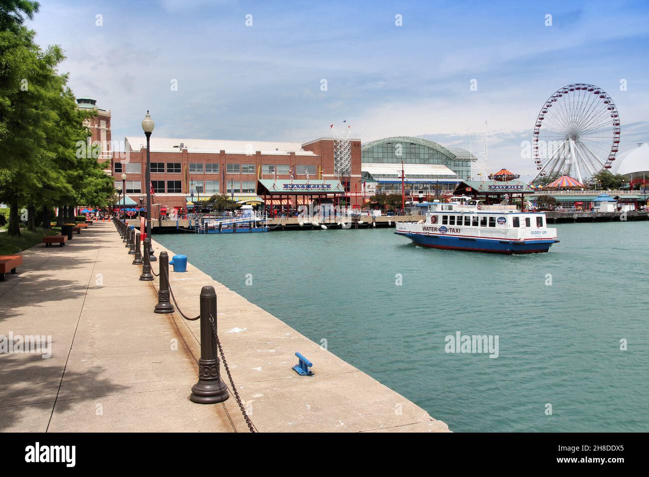 CHICAGO, USA - JUNE 26, 2013: People visit the Navy Pier in Chicago. The 3,300-foot pier built in 1916 is one of most recognized Chicago landmarks. Stock Photo
