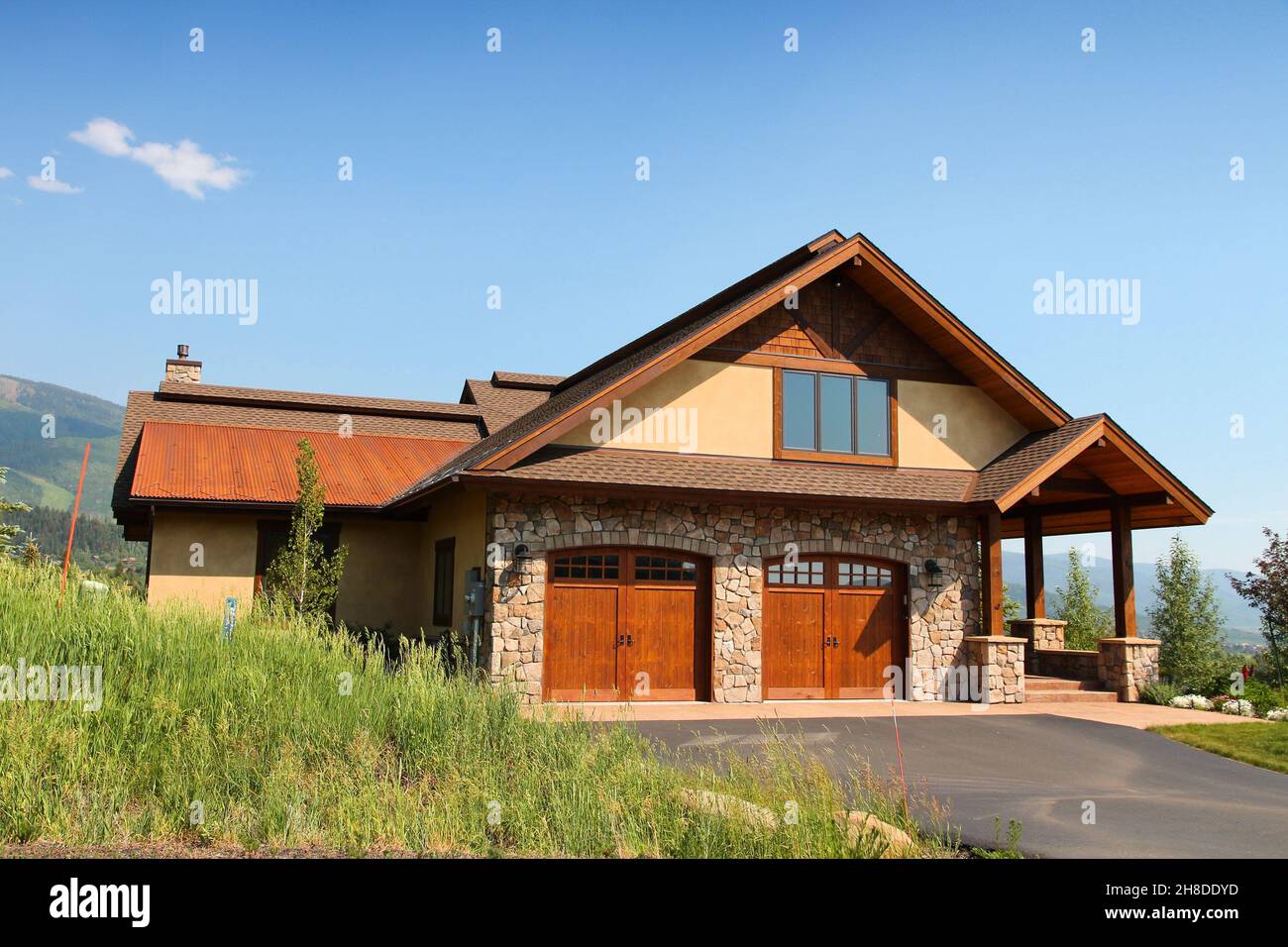 STEAMBOAT SPRINGS, COLORADO - JUNE 19, 2013: Generic house seen from public road in Steamboat Springs, Colorado. Over 5 million homes are sold annuall Stock Photo
