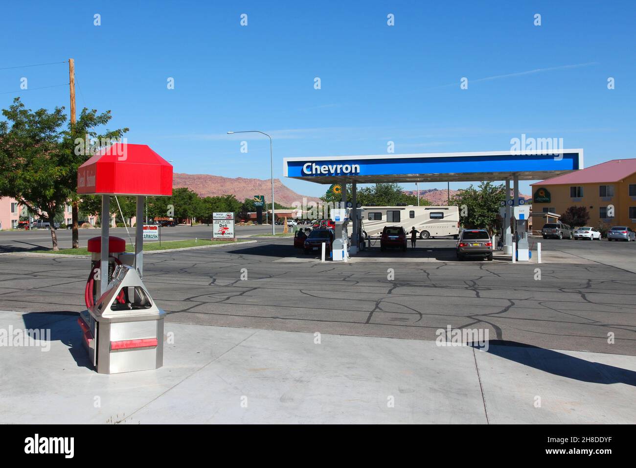 MOAB, USA JUNE 22, 2013 People fill up their cars at Chevron gas