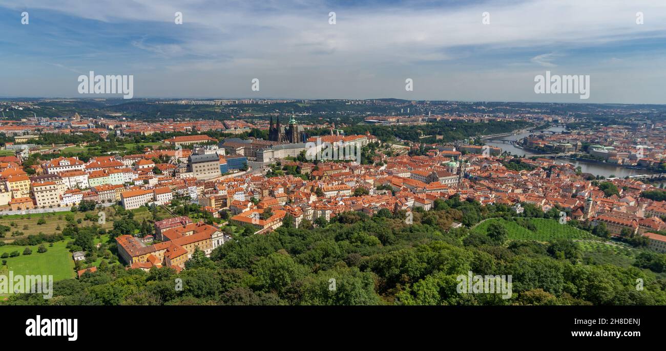 A view over Prague's Lobkovická zahrada to the red-roofed buildings of Malá Strana, Prague Castle and St Vitus Cathedral. Stock Photo