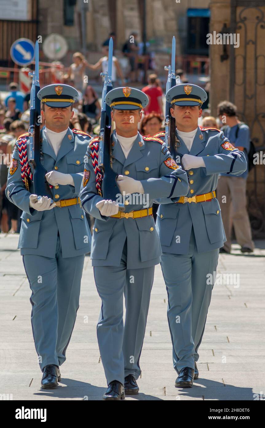 Three members of the Prague Castle Guard, in summer uniform and shouldering, Vz 52/57 Ceremonial Rifles parade at the changing of the guard ceremony. Stock Photo