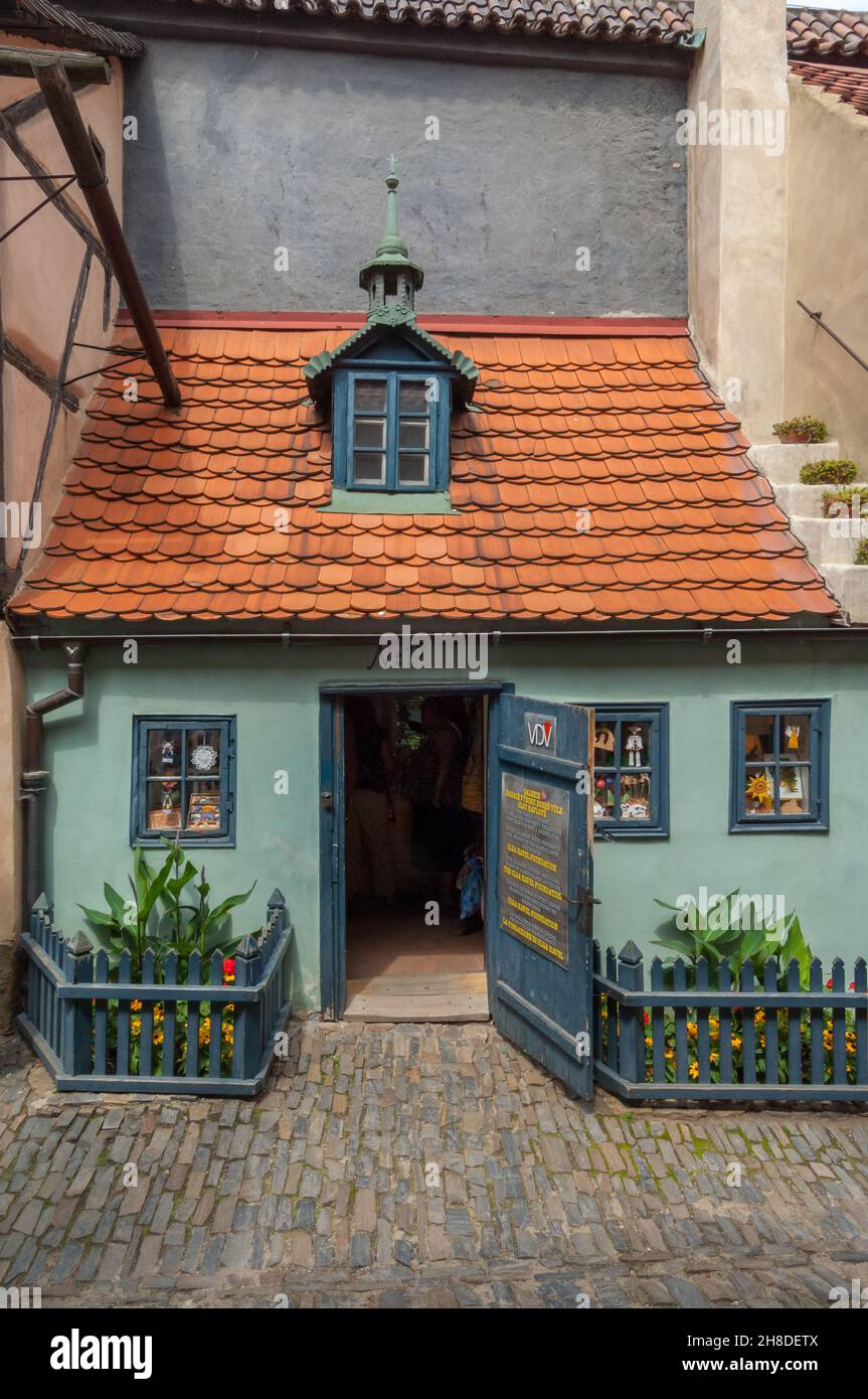 A colourful tiny house in Prague Castle's Golden Lane now houses the Olga Havel Foundation selling handicrafts made by handicapped people Stock Photo