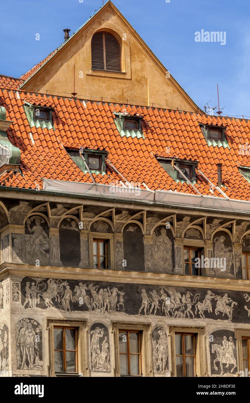 Ornate sgraffito, depicts scenes from historical & mythological sources on the facade of The House at the Minute, part of the Old Town Square, Prague Stock Photo