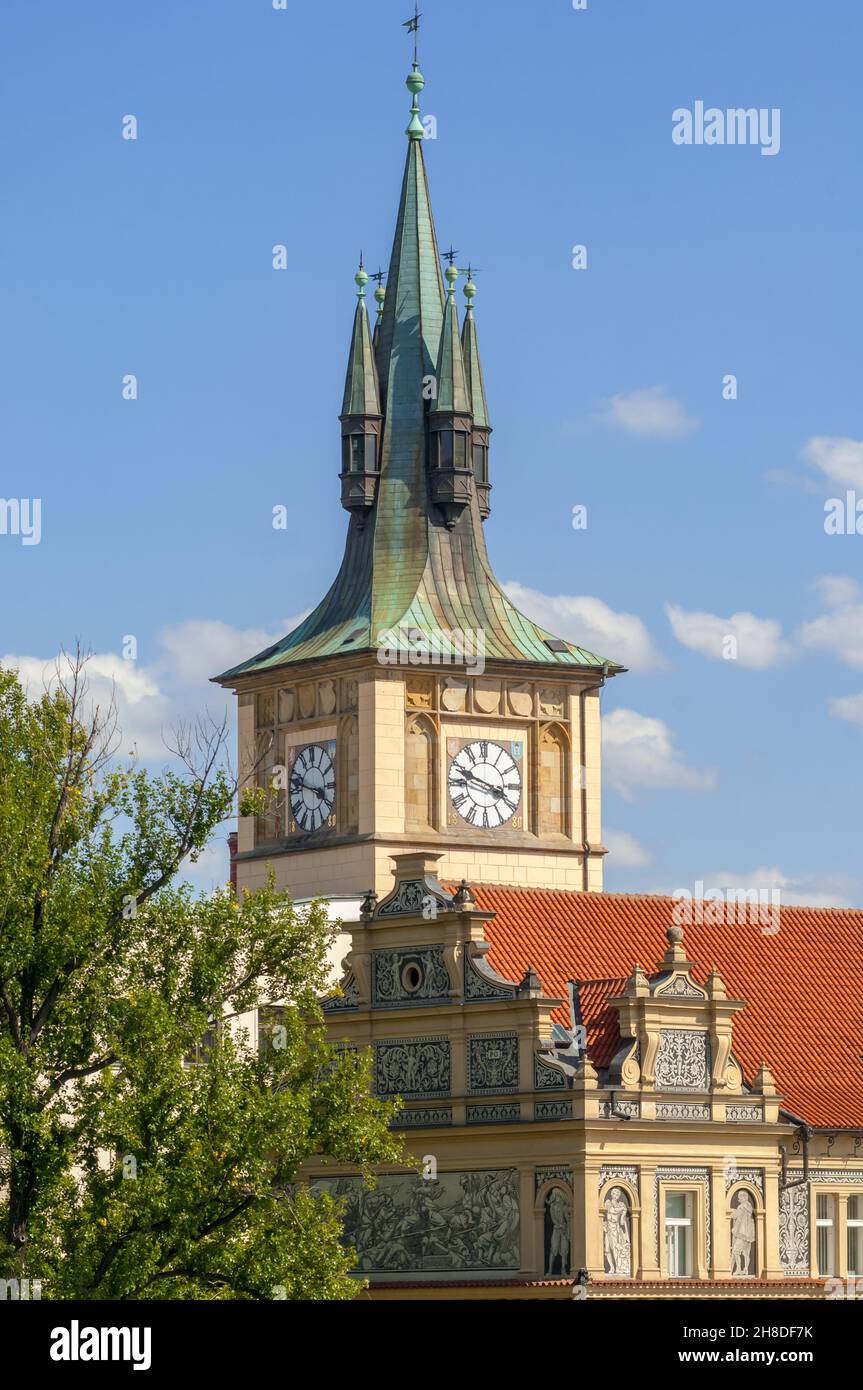 The spire of Antonín Wiehl's Old Water Works building rises over Jan Koula's ornamental sgraffito on the facade of the main building on Novotný lávka Stock Photo