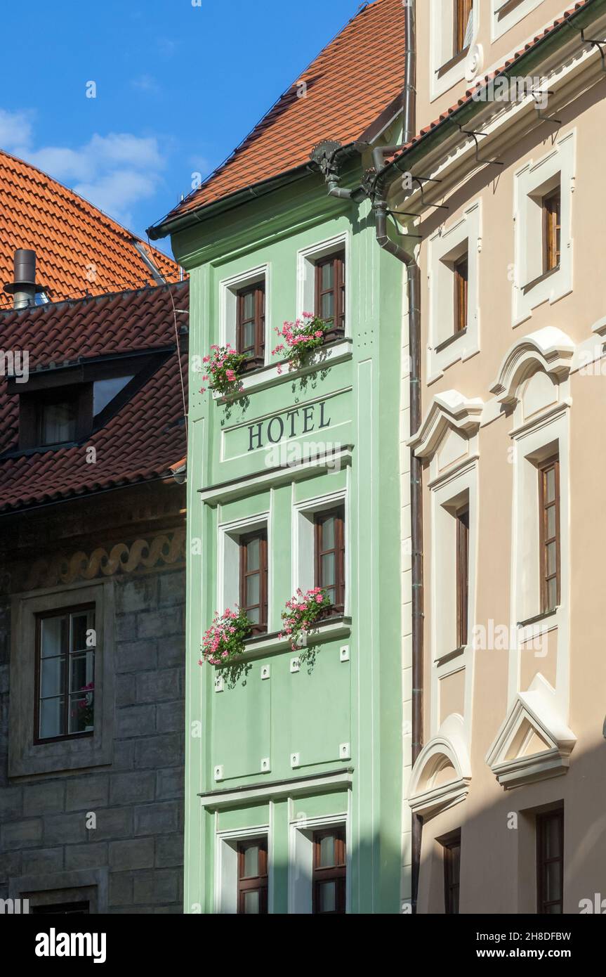 The green facade and colourful window boxes of The Clementin Hotel in Seminářská Street in Prague's historic old town Stock Photo
