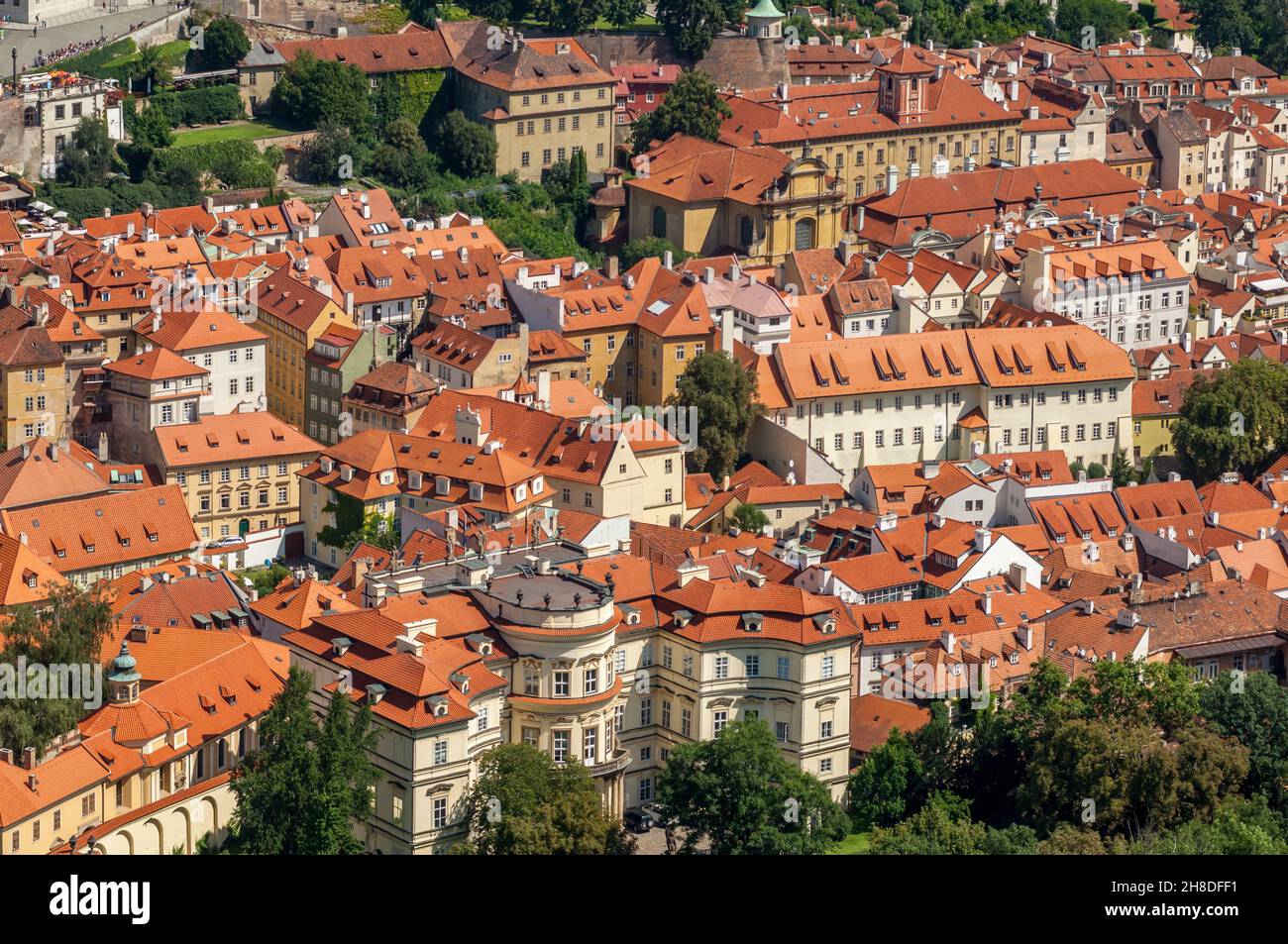 The German Embassy and the other colourful historic buildings of Malá Strana with their terra cotta tiled roofs and dormer windows Stock Photo