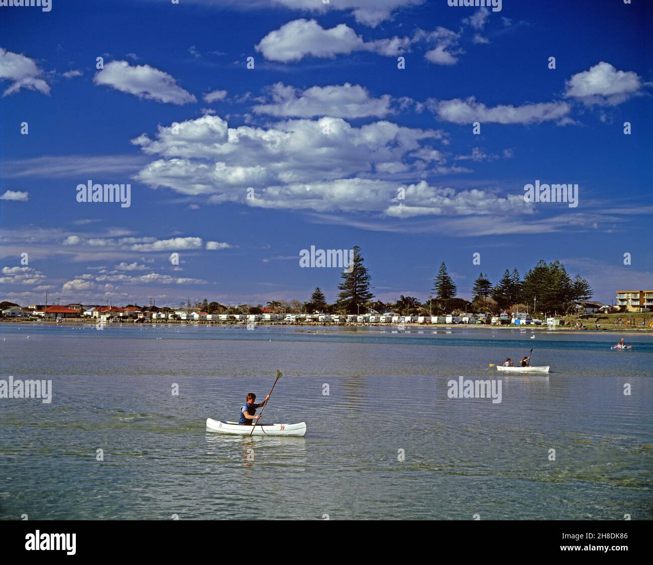 Australia. New South Wales. Central Coast region. The Entrance. People in canoes on Tuggerah Lake. Stock Photo