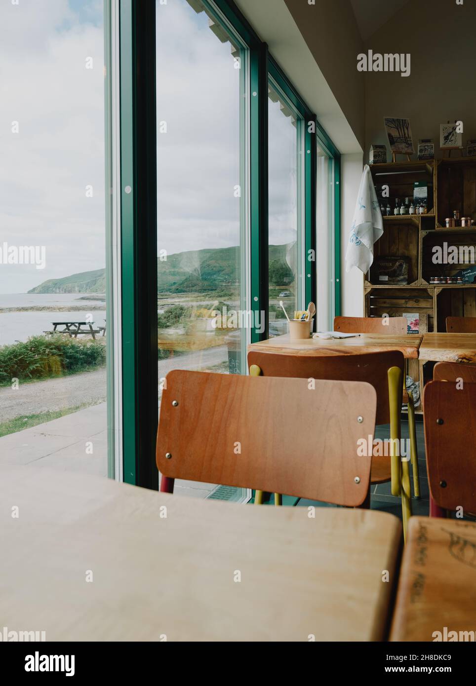 Window view - Empty chairs and tables of a small cafe in Lochbuie on the Isle of Mull in Scotland UK Stock Photo