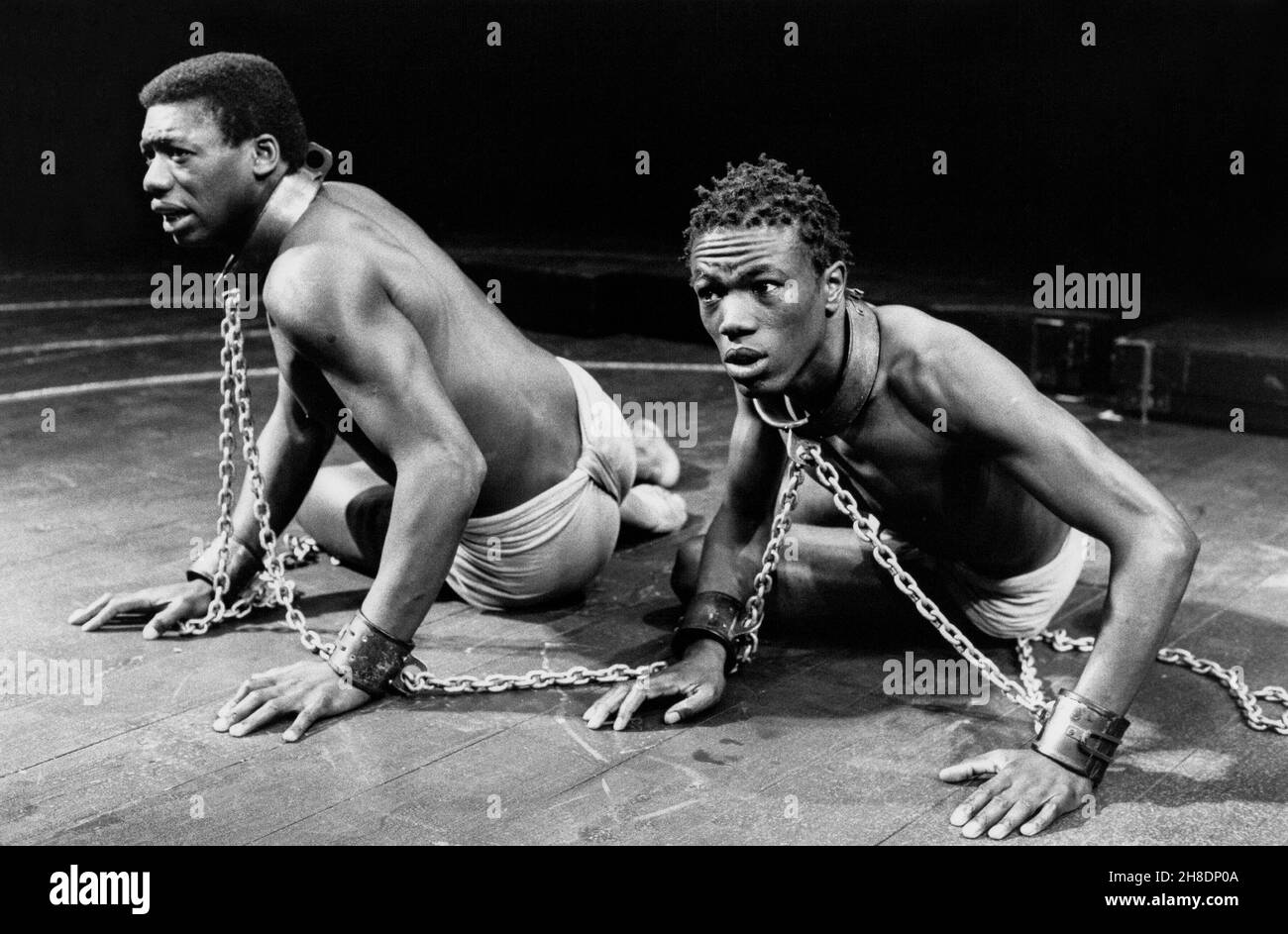 l-r: Hakeem Kae-Kazim (Ide), Carlton Chance (Mobote) in INDIGO by Heidi Thomas at the Royal Shakespeare Company (RSC), The Other Place, Stratford-upon-Avon  08/07/1987  design: Roger Glossop  lighting: Paul Denby  director: Sarah Pia Anderson Stock Photo