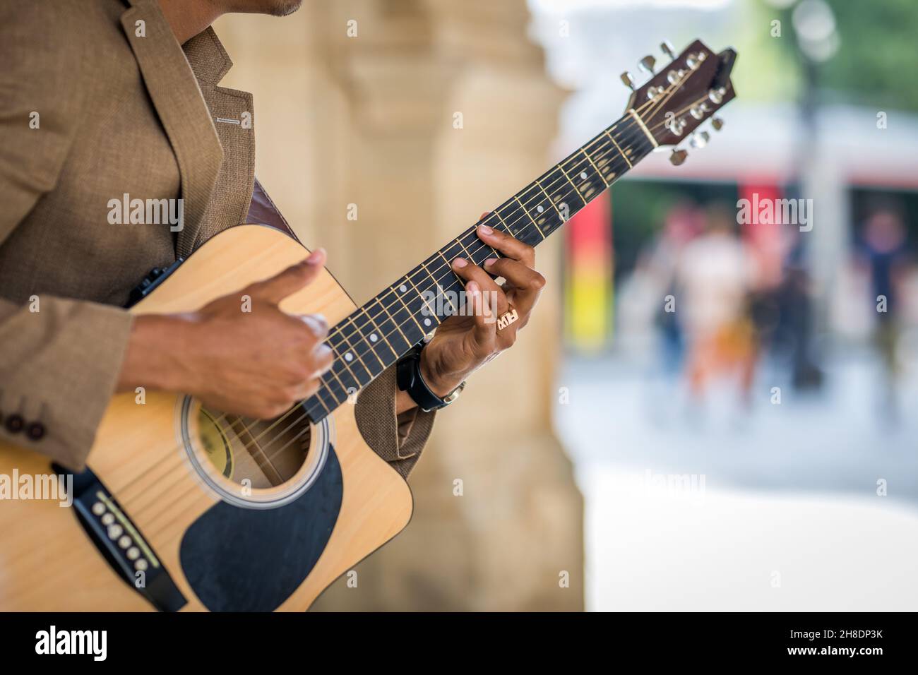 Detail of latin man playing guitar in the street Stock Photo