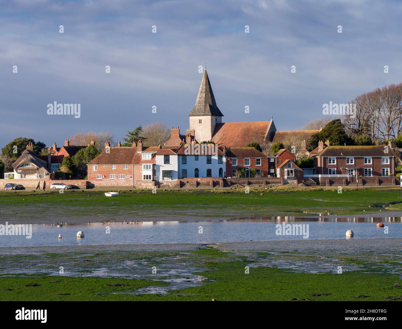 The village of Bosham beside Chichester Harbour at low tide, West Sussex, England. Stock Photo