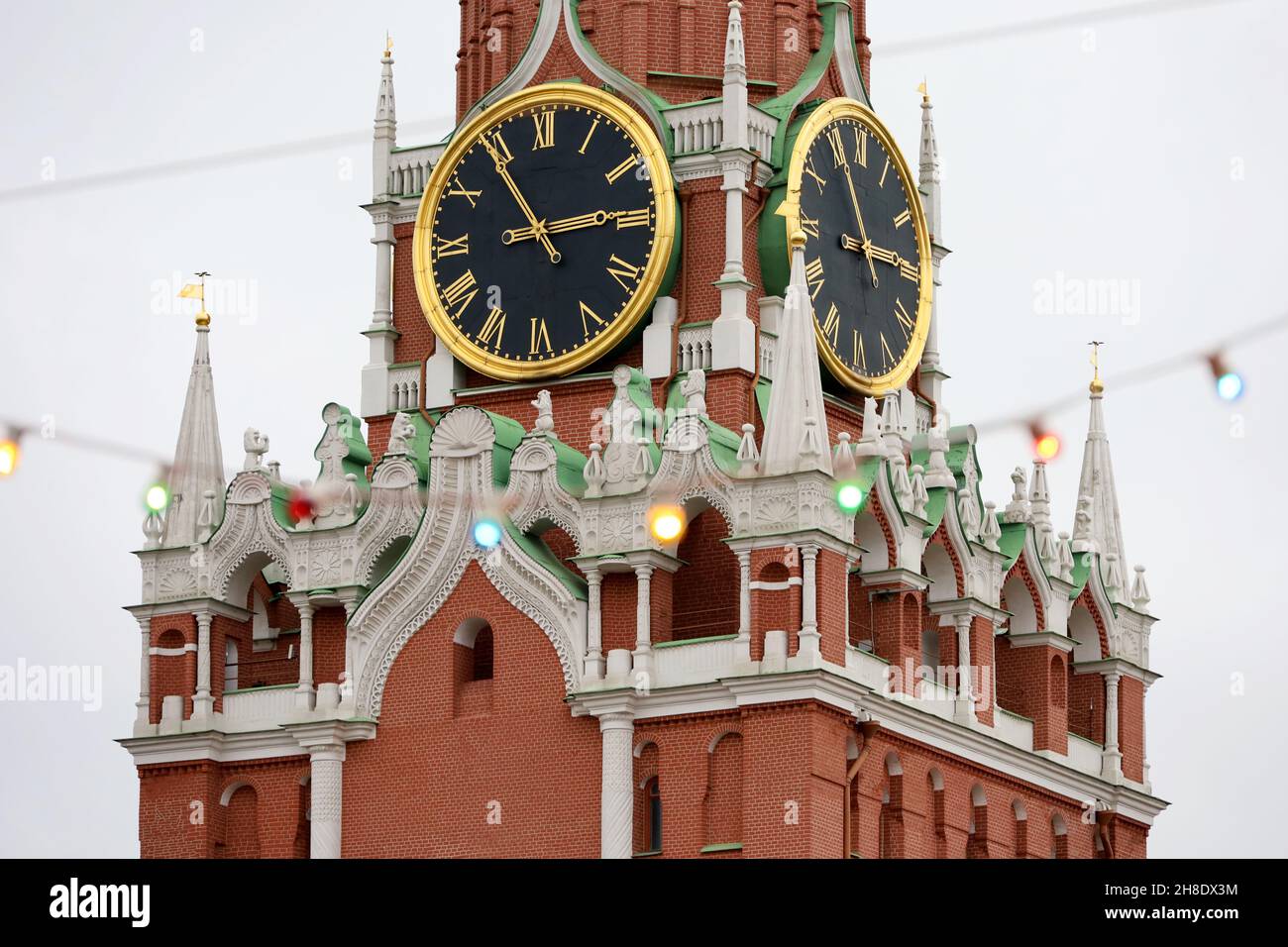 Christmas illumination on Red square in Moscow, New Year celebration in Russia. Festive lights on background of Kremlin tower Stock Photo