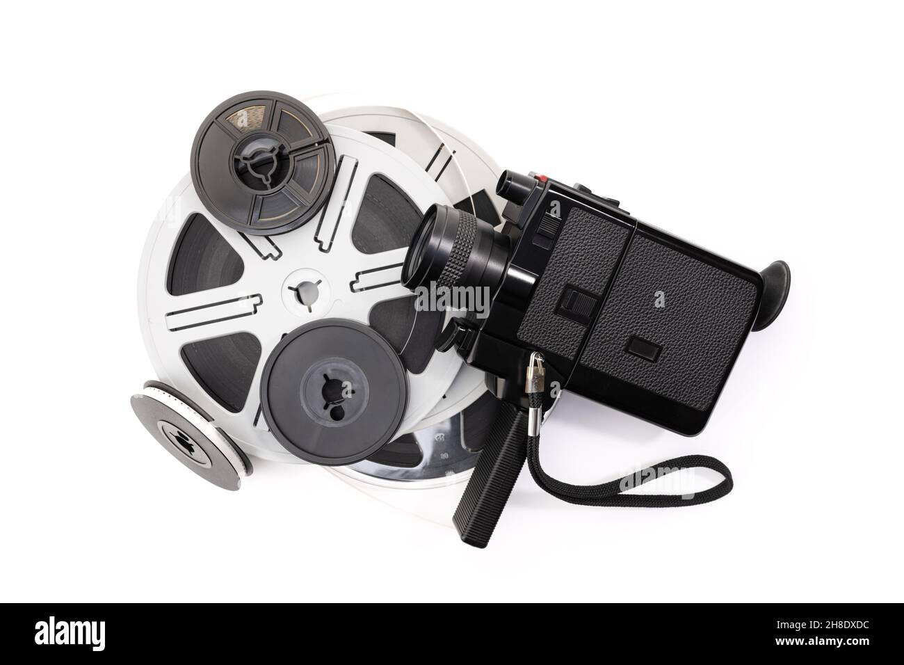 Vintage super 8 camera and film reels isolated on white background. Movie film background Stock Photo