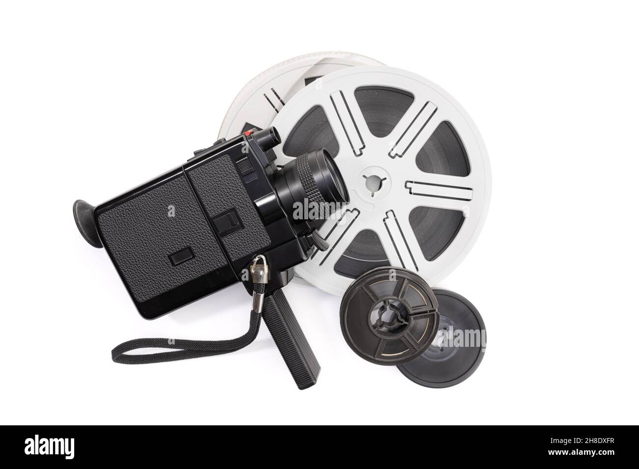 Super 8 camera and film reels isolated on white background. Copy space Stock Photo