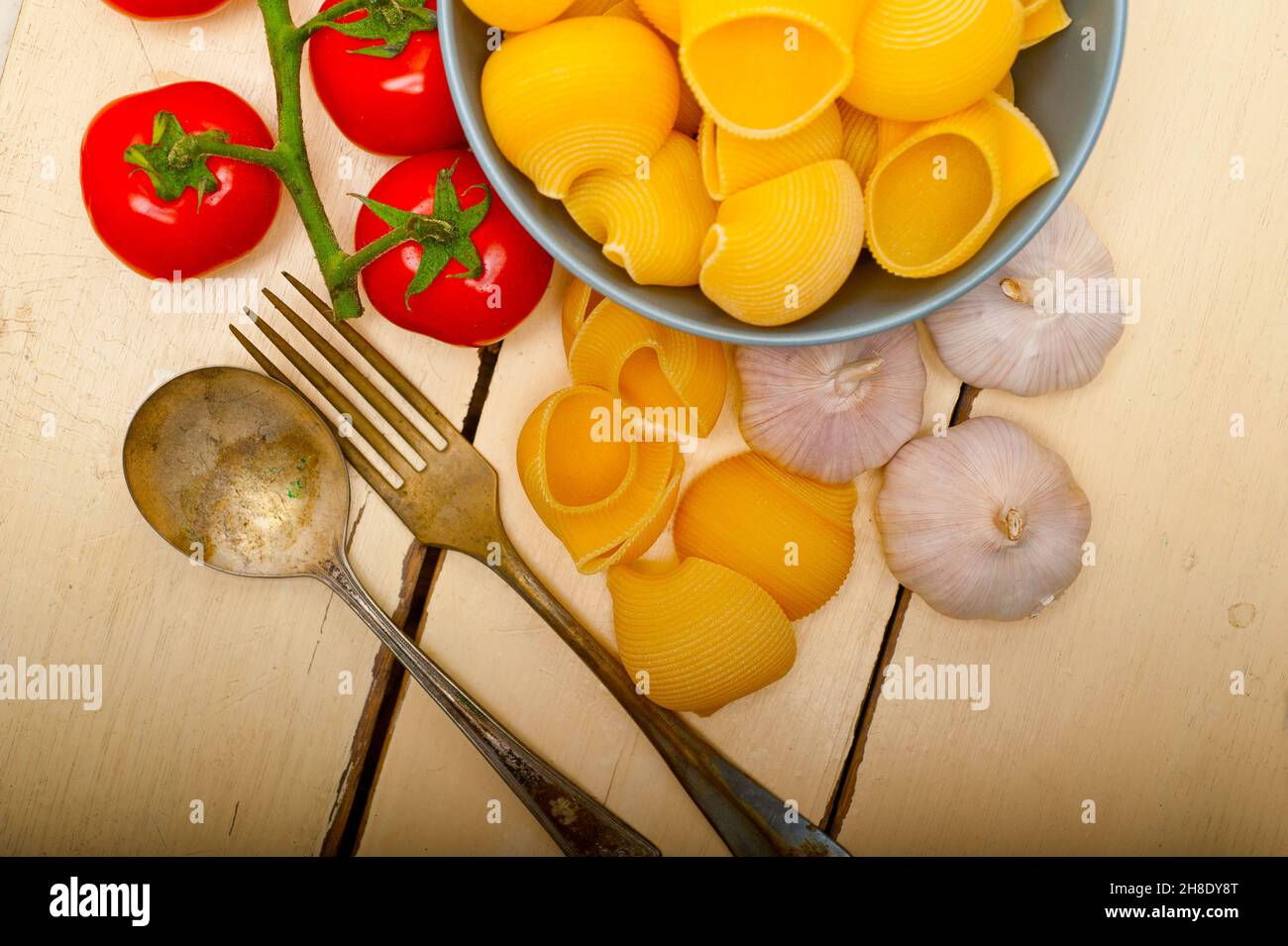 Italian snail lumaconi pasta with ripe cherry tomatoes sauce ingredients Stock Photo