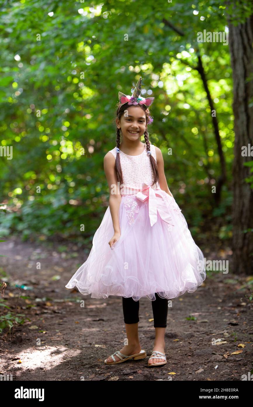Portrait of adorable kid in the natural forest park. Stock Photo