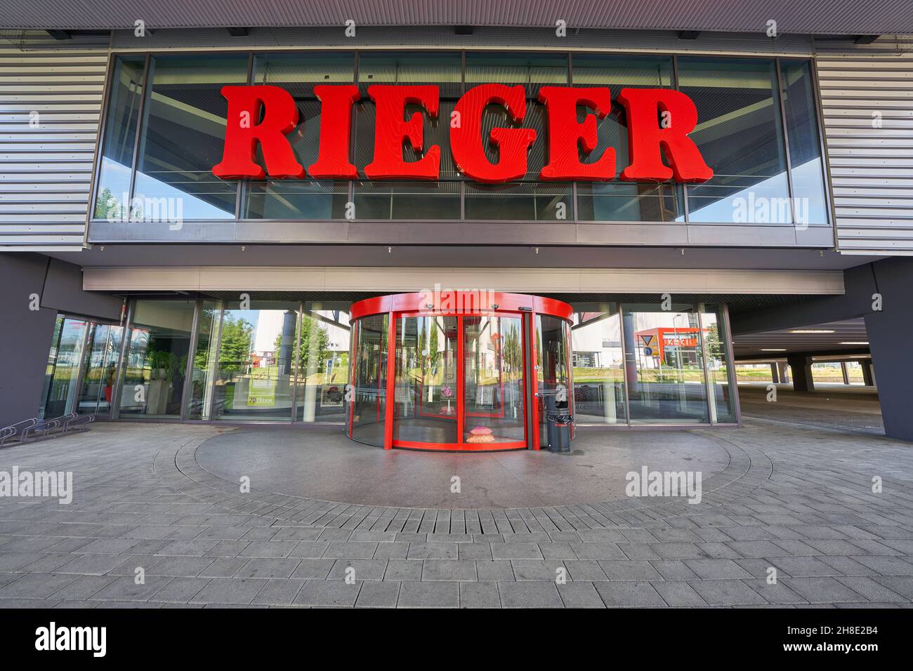 Göppingen, Germany - May 21, 2020: Möbel ( furniture ) Rieger, revolving door at the main entrance, large red letters, deep perspective, wide angle. G Stock Photo