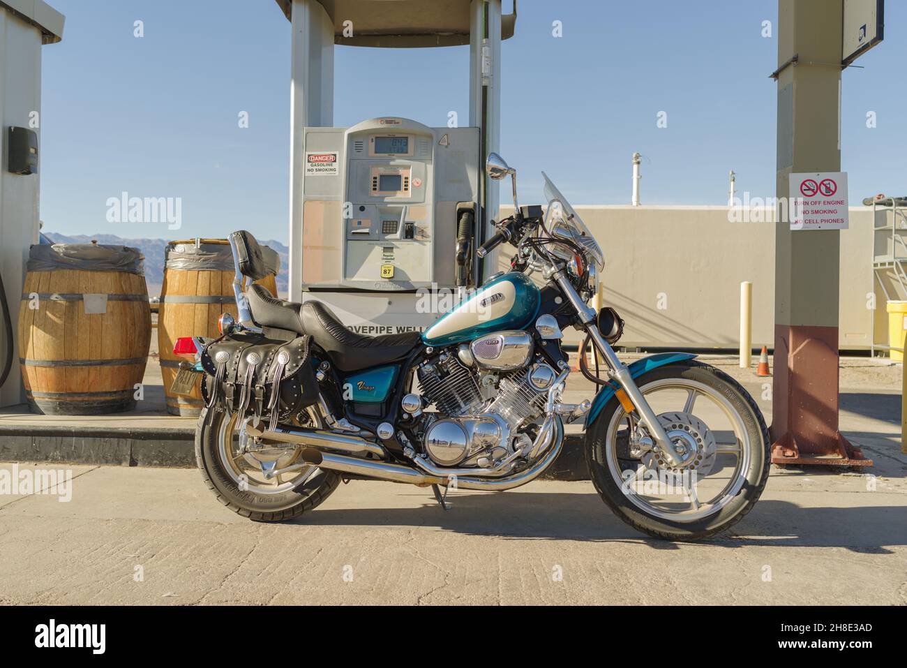 1994 Yamaha Virago motorcycle shown at a gas station in Stovepipe Well, Death Valley, California. Stock Photo