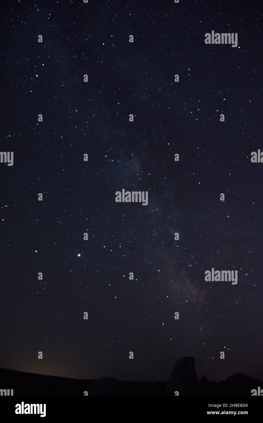 Vertical shot of the beautiful starry night sky Stock Photo - Alamy