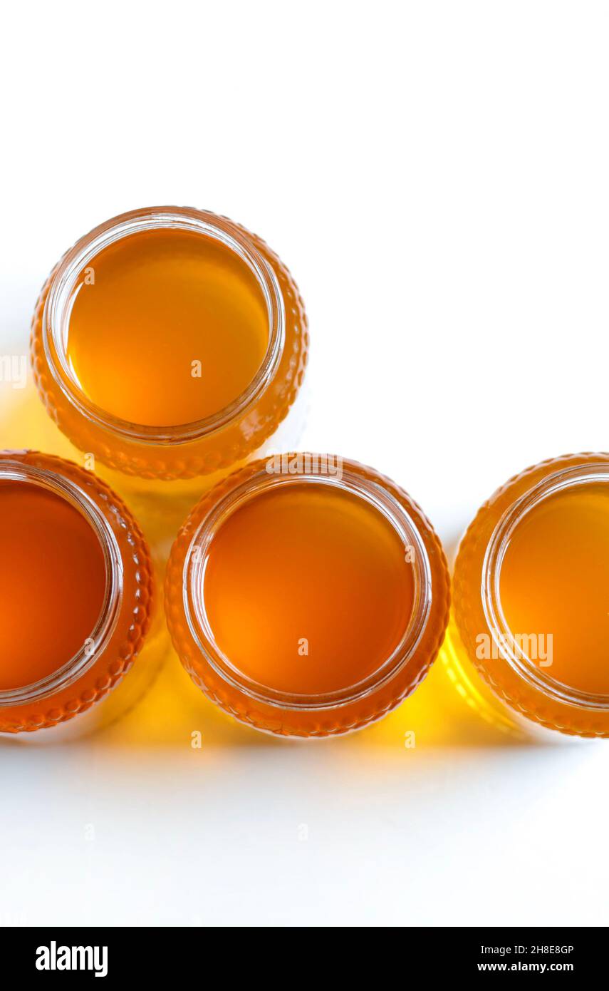 Honey pots isolated on white background. Directly above. Flat lay Stock