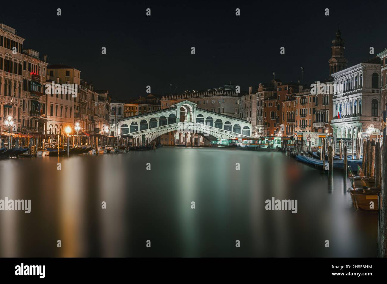 Rialto Bridge in beautiful Venice, Italy during nighttime Stock Photo ...