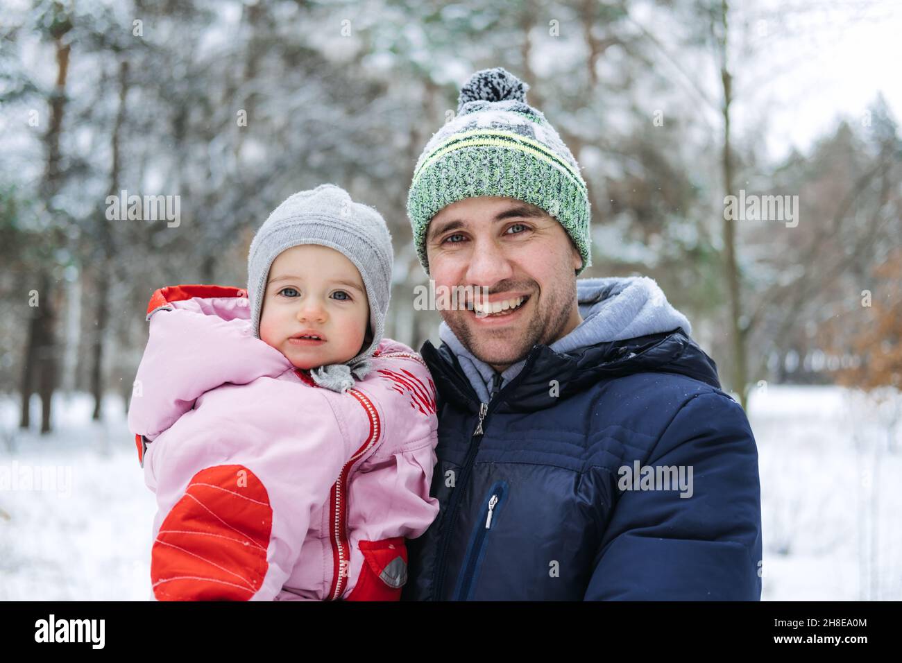 Outdoor Portrait Of Young Father And Baby Girl Daughter In Winter Outdoor Portrait Of Young Father And Baby Girl Daughter In Winter