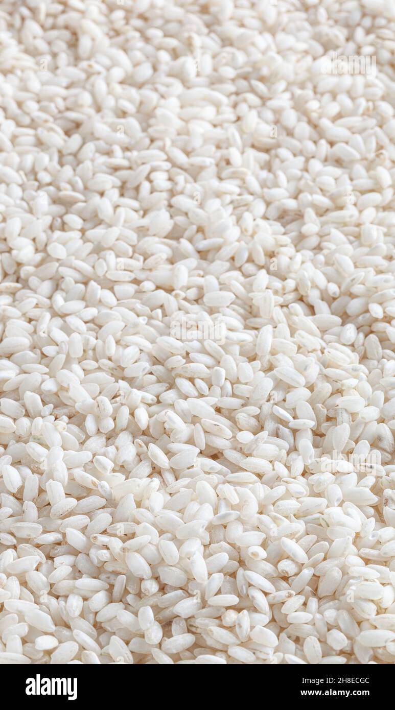 Uncooked arborio rice background Stock Photo Alamy