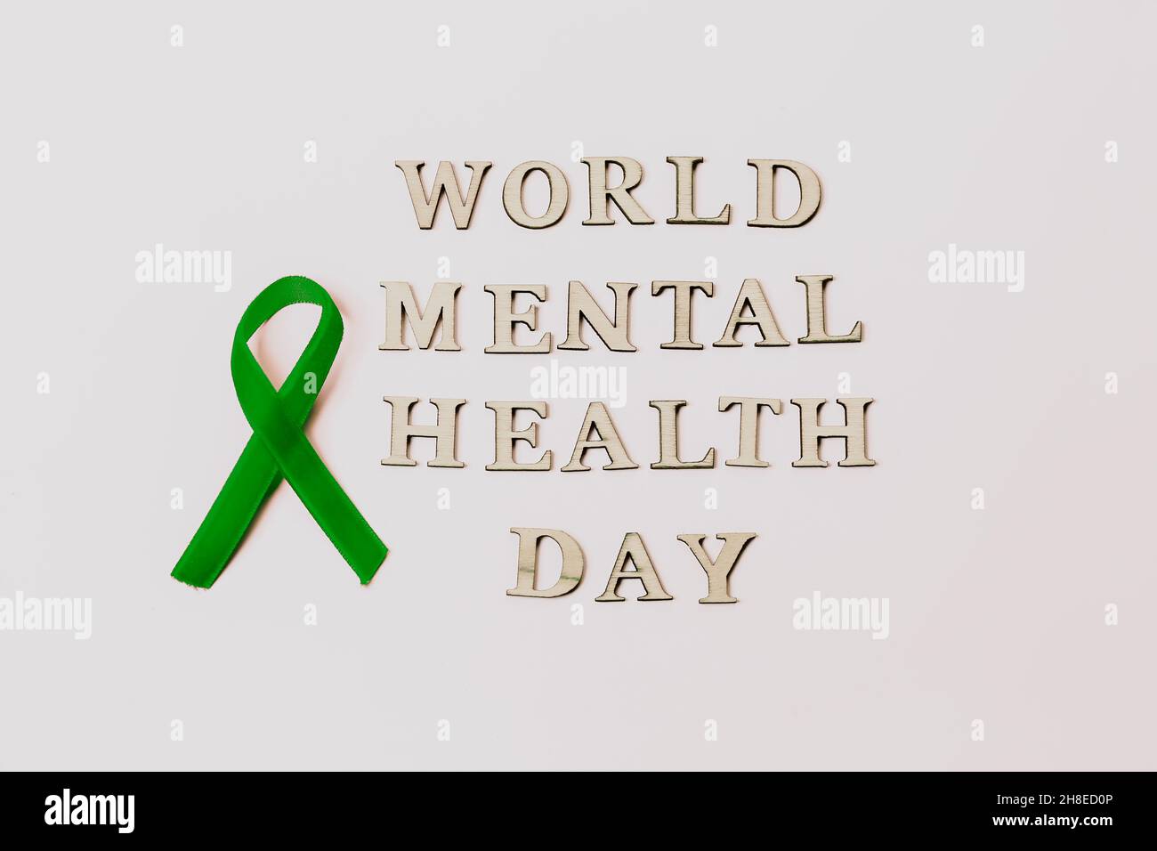 Green velvet ribbon on white background. World Mental Health Day ...