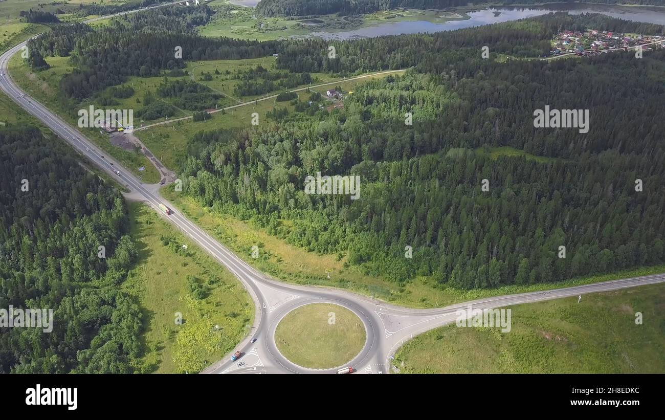 Top view of rural roundabout. Clip. Traffic on roundabout rural road in