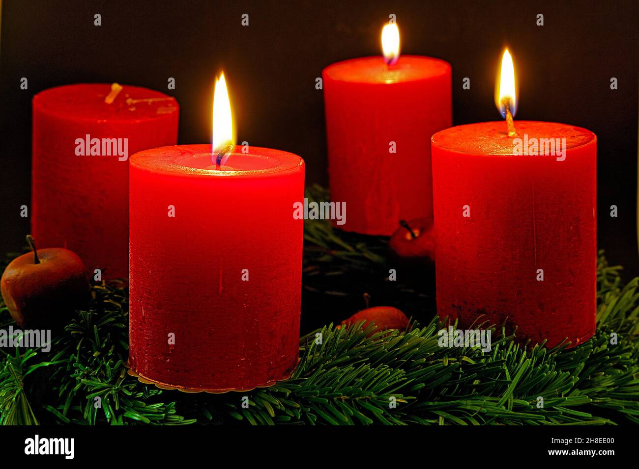advent wreath with three burning candles for the third advent sunday