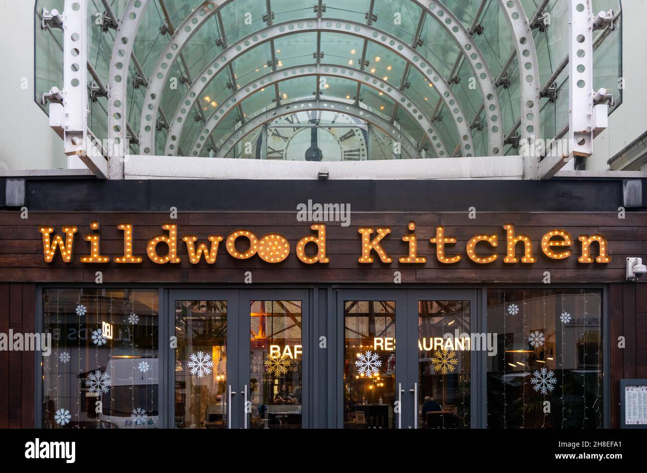 Sign over the entrance to Wildwood Kitchen restaurant bar in Liverpool City Centre Stock Photo