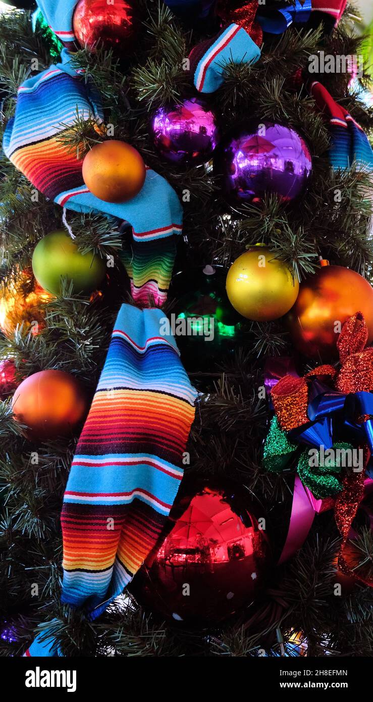 Hispanic-themed decorations on a Christmas tree; Mexican blanket ...