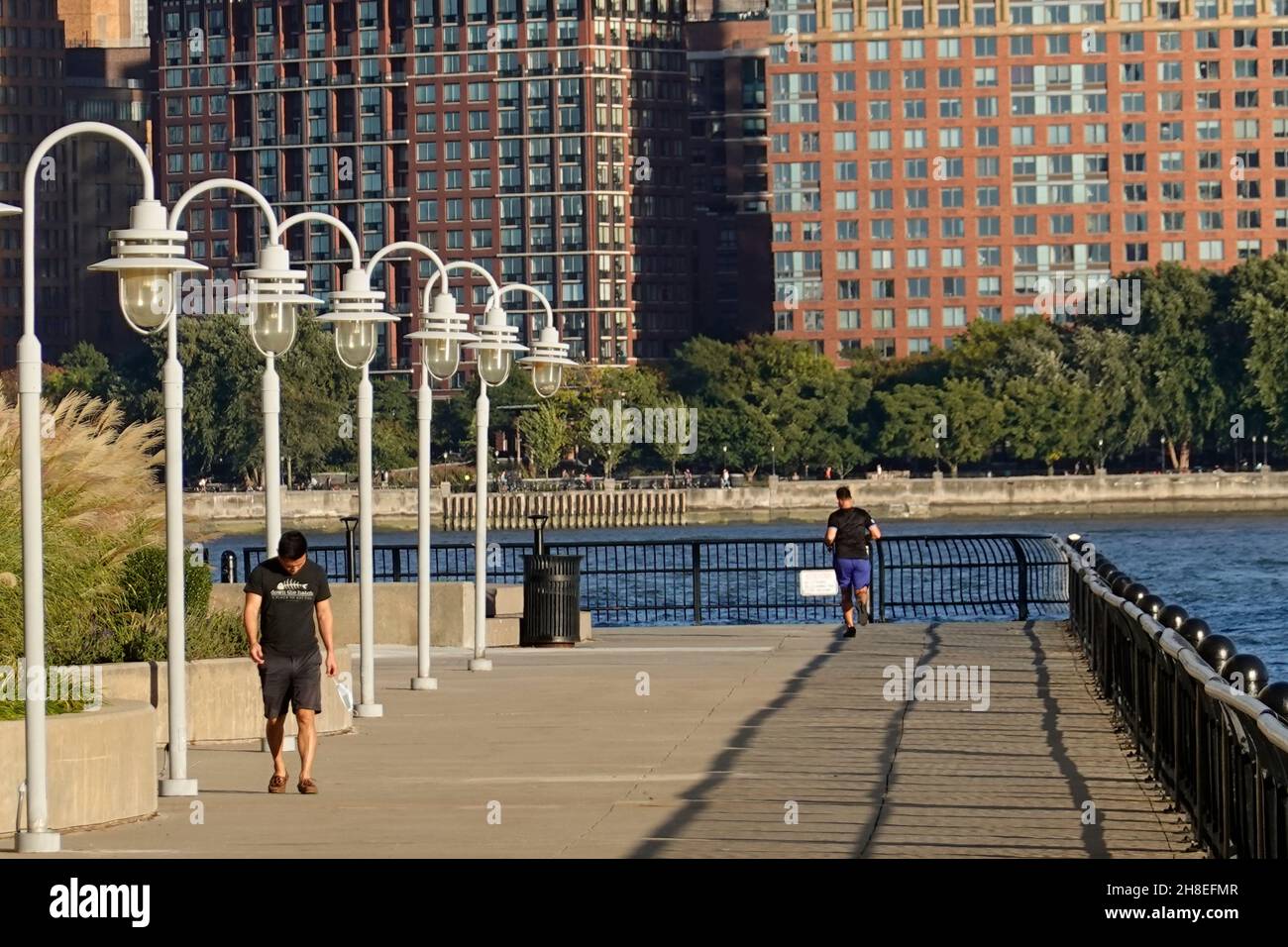 men exercising on a pier in Hoboken New Jersey Stock Photo