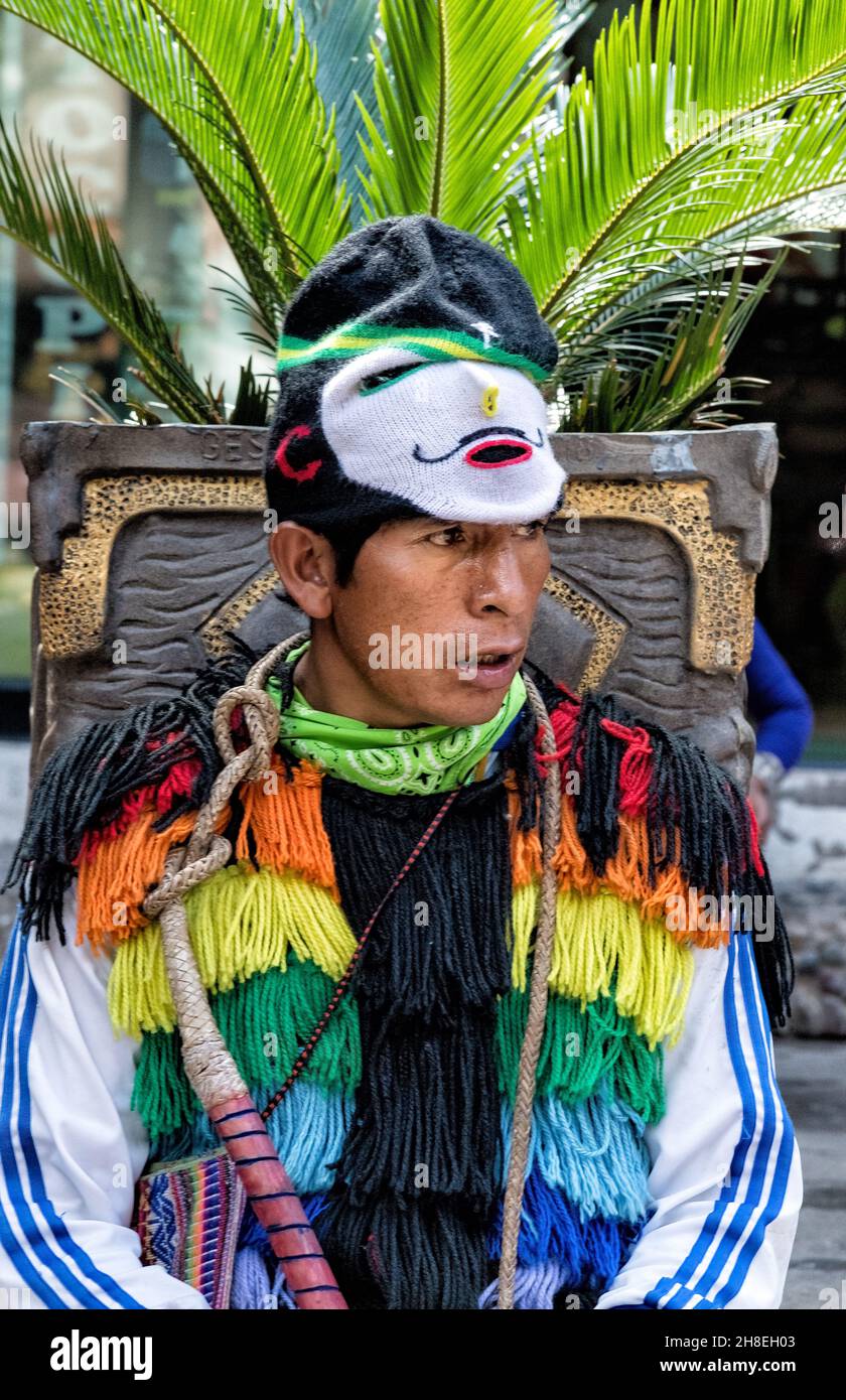 Participant dressed in a Colourful costume for the traditional costume parade in Aguas Calientes, Peru Stock Photo