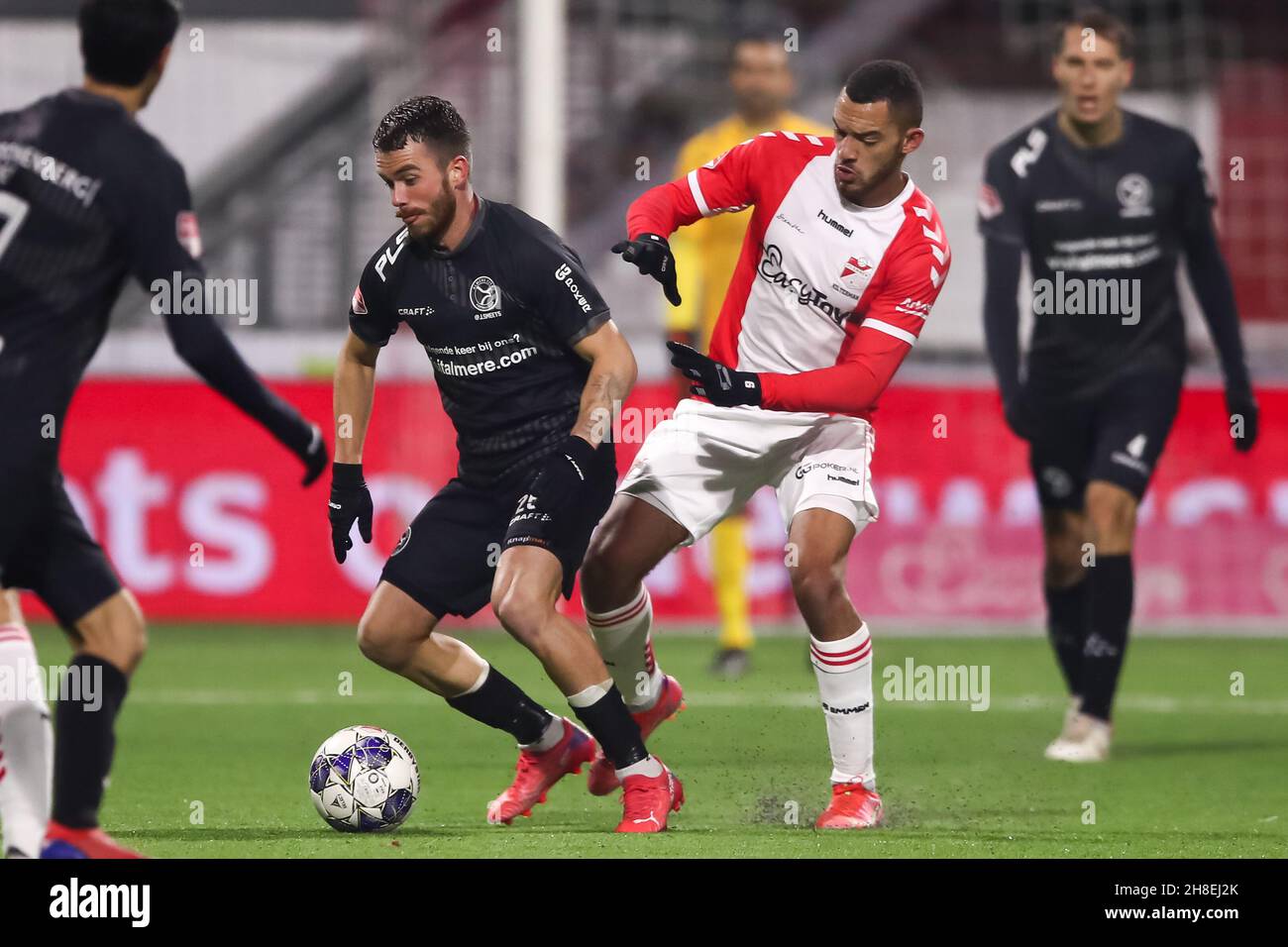 EMMEN, NETHERLANDS - NOVEMBER 29: Jeredy Hilterman of FC Emmen and Faris  Hammouti of Almere City FC battle for possession during the Dutch  Keukenkampioendivisie match between FC Emmen and Almere City FC