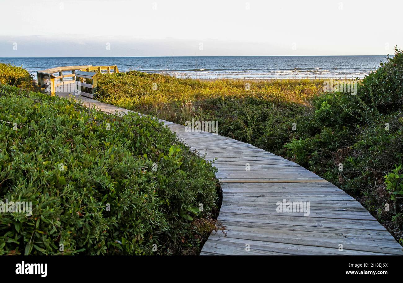 A wooden boardwalk leads to a deserted beach at Kiawah Island, South Carolina. Stock Photo